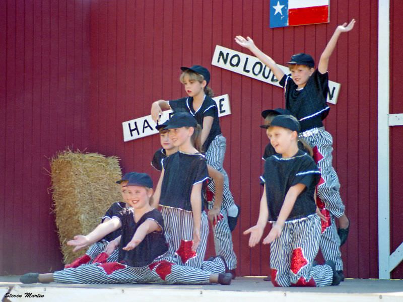 #21 Girls from a dance school strike a pose, Keller, 1995