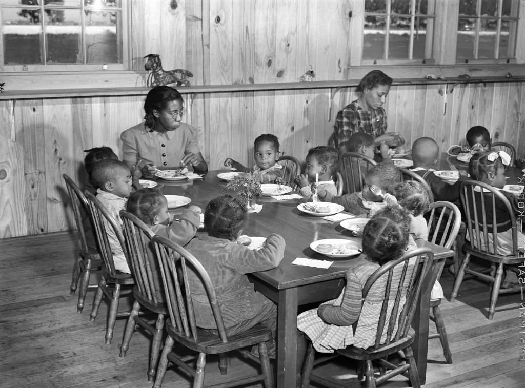 #104 Children of Agricultural Workers in Day Nursery eating Lunch, Okeechobee Migratory Labor Camp, Belle Glade, Florida, February 1941