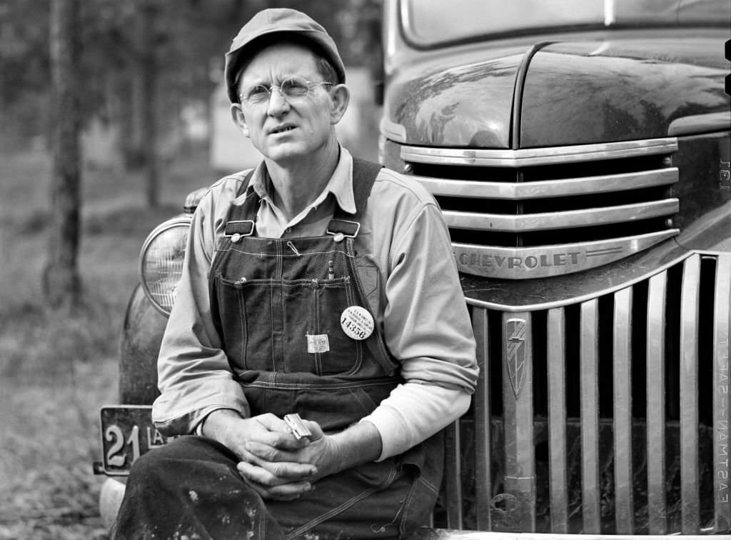 #118 Construction Worker sitting on Car before leaving for Evening Shift, Camp Livingston, Alexandria, Louisiana, December 1940