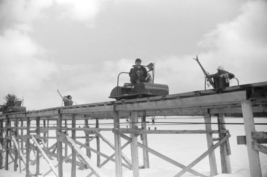 #141 Group of People on Ski Lift, Cranmore Mountain, North Conway, New Hampshire, March 1940 .