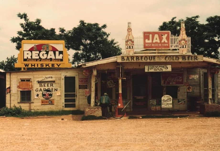 #150 A cross roads store, bar, juke joint, and gas station in the cotton plantation area, Melrose, Louisiana, 1940.