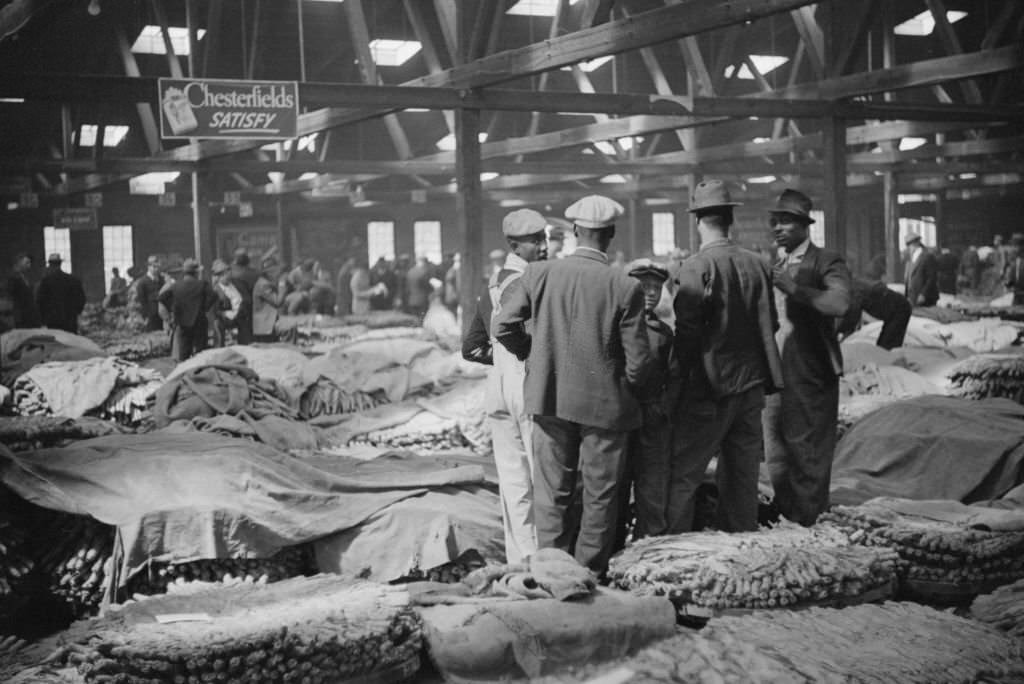 #157 Farmers Waiting for Tobacco to be Sold at Auction in Warehouse, Durham, North Carolina, November 1939