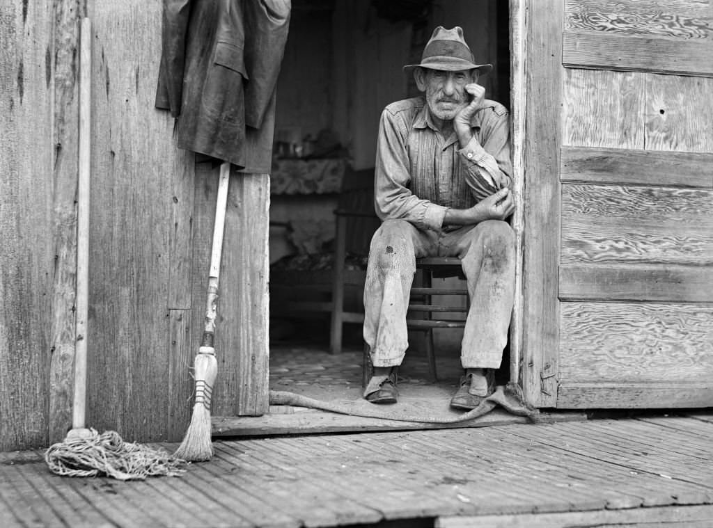 #202 Spanish Muskrat Trapper in Doorway of his Marsh Camp, Delacroix Island, Saint Bernard Parish, Louisiana, January 1941
