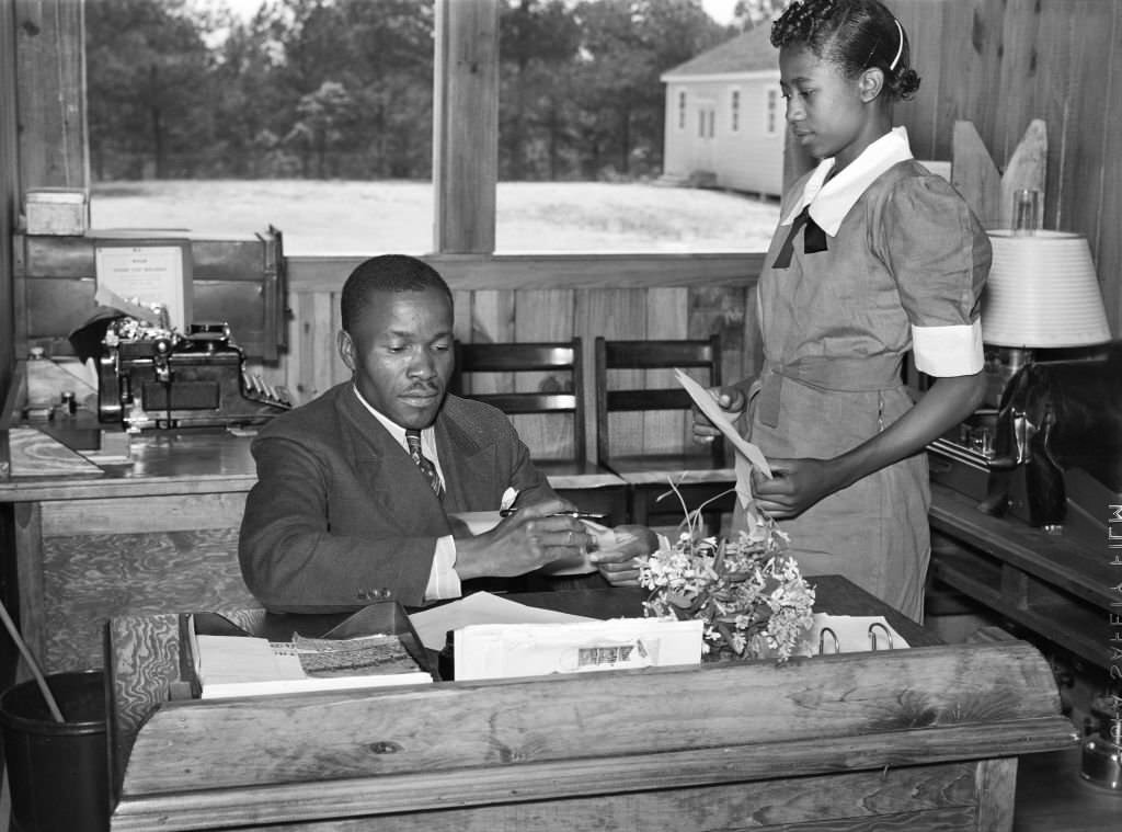 #29 Students learning Office and Secretarial work by helping Principal Robert Pierce, Gee’s Bend, Alabama, 1939