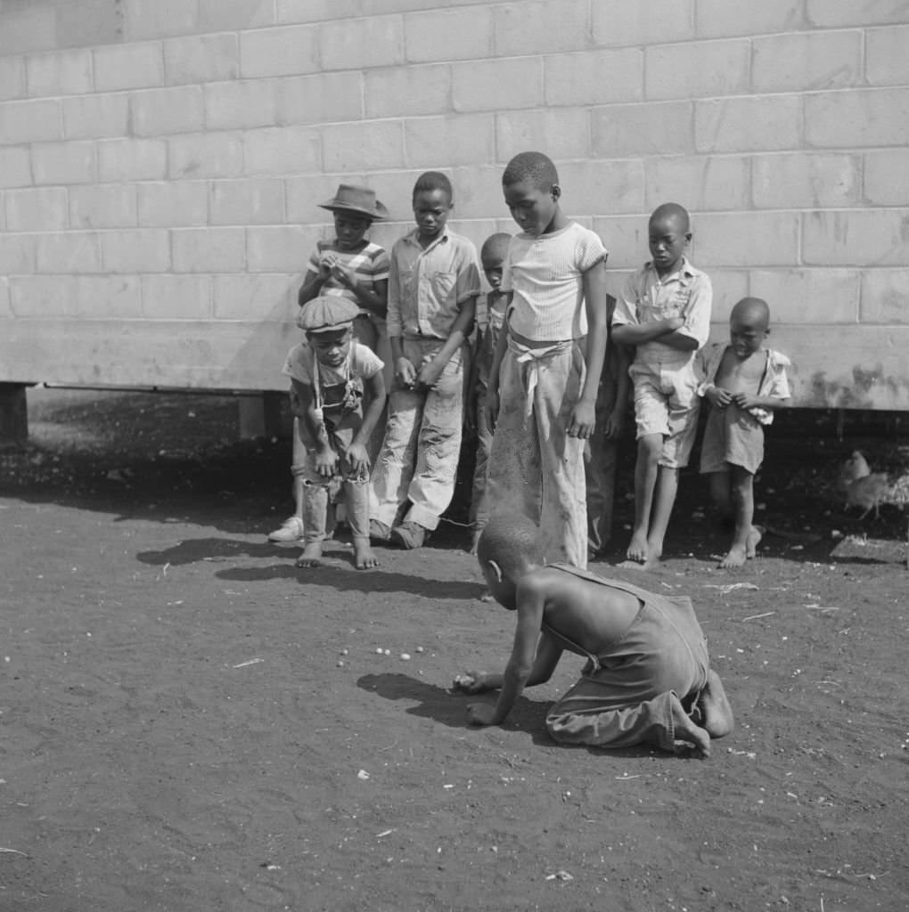 #230 Children Playing Marbles, Okeechobee Migratory Labor Camp, Belle Glade, Florida, June 1940