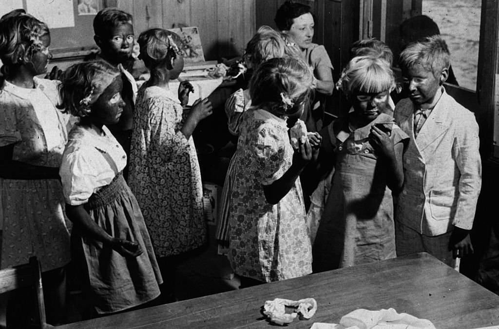 #2 May 1939: A group of young children being made up to take part in a song and dance routine during May Day-Health Day festivities at Ashwood Plantations, 1939