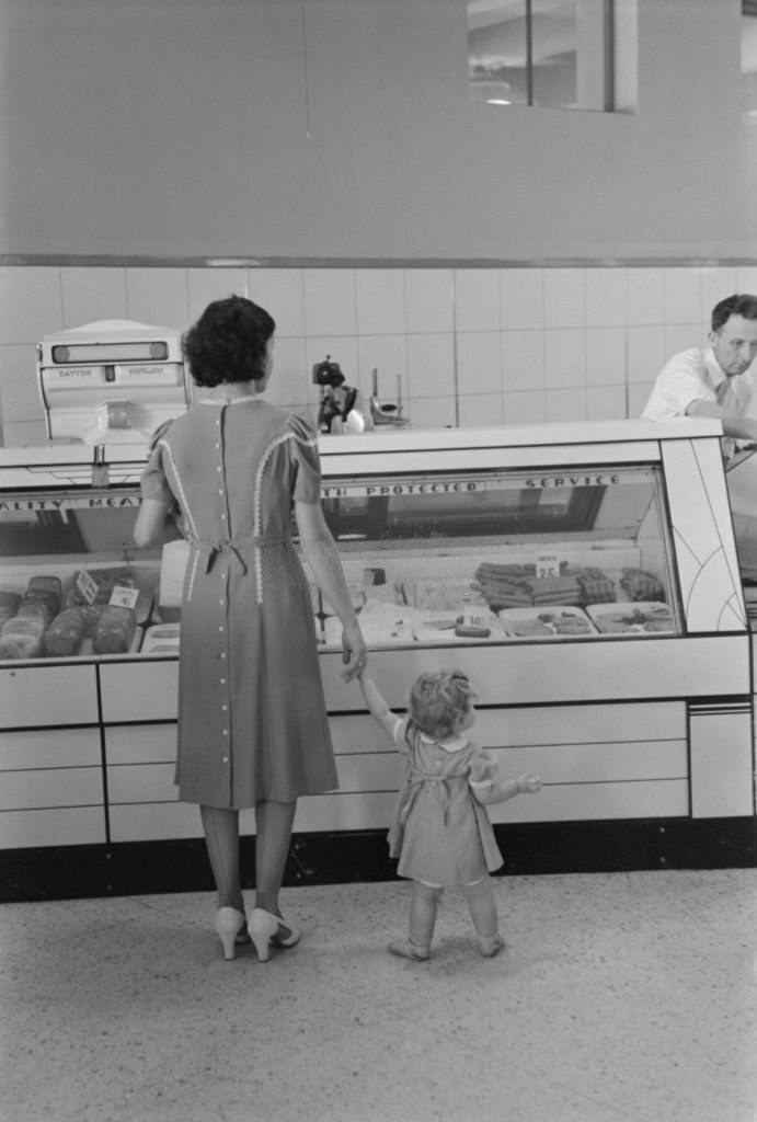 #81 Mother with Child Shopping in Co-Op Store, Greenbelt, Maryland, 1939