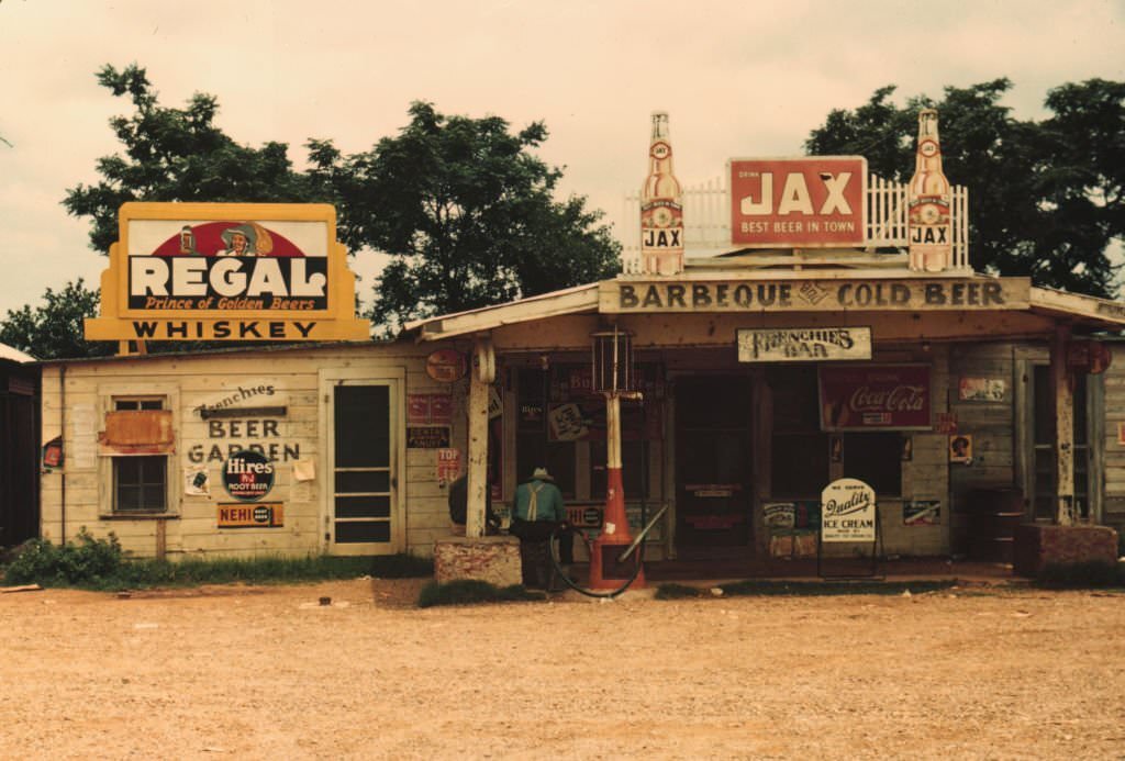 #83 A cross roads store, bar, “juke joint,” and gas station in the cotton plantation area, Melrose, Louisiana., 1940