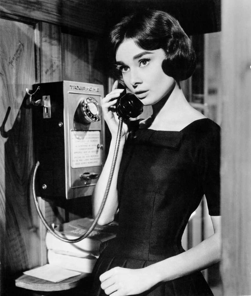 Audrey Hepburn uses a taxiphone in a scene from the Allied Artists film ‘Love In The Afternoon’, 1957.