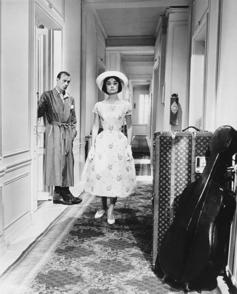 Frank Flannagan (Gary Cooper) watches Ariane Chavasse (Audrey Hepburn) walk down the hallway ‘Love in the Afternoon’, 1957.