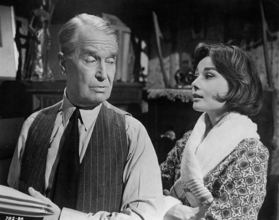 Maurice Chevalier looking over his shoulder at Audrey Hepburn in a scene from the film ‘Love In The Afternoon’, 1957.