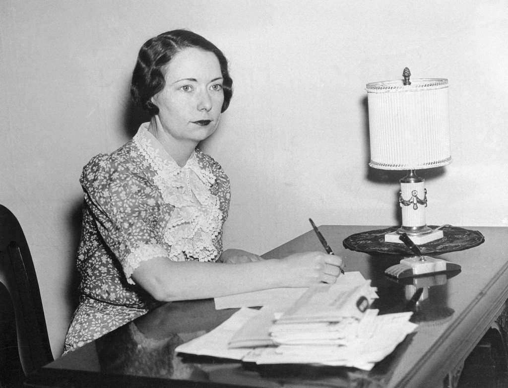 #10 Novelist Margaret Mitchell sits at her desk at home in Georgia following the announcement that her novel Gone with the Wind had won the Pulitzer Prize.