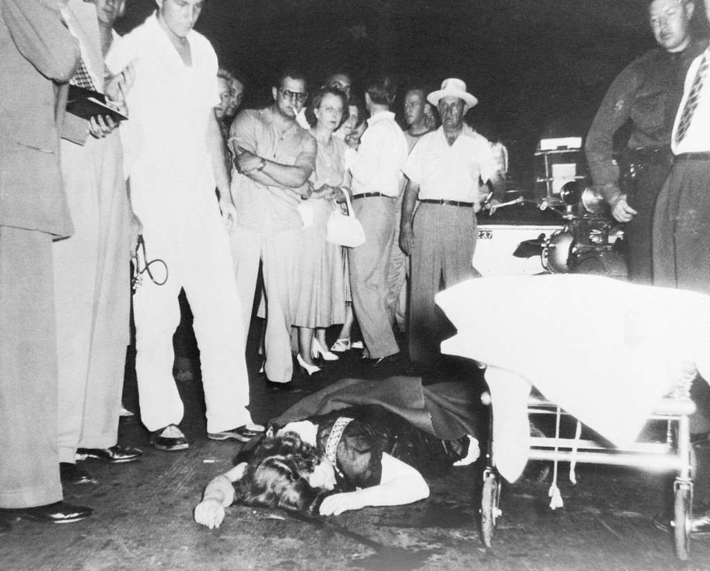 #6 Margaret Mitchell lies hurt on the paving of Peachtree Street in Atlanta, a street made famous in her novel.