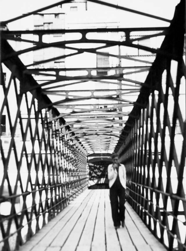 #26 Annemarie Schwarzenbach crossing the Eiffel Bridge over the Onyar river, Girona, 1933