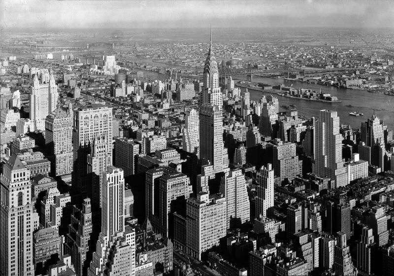 #4 View from Empire State Building to Chrysler Building, and Queensboro Bridge, New York City, low viewpoint, January 1932