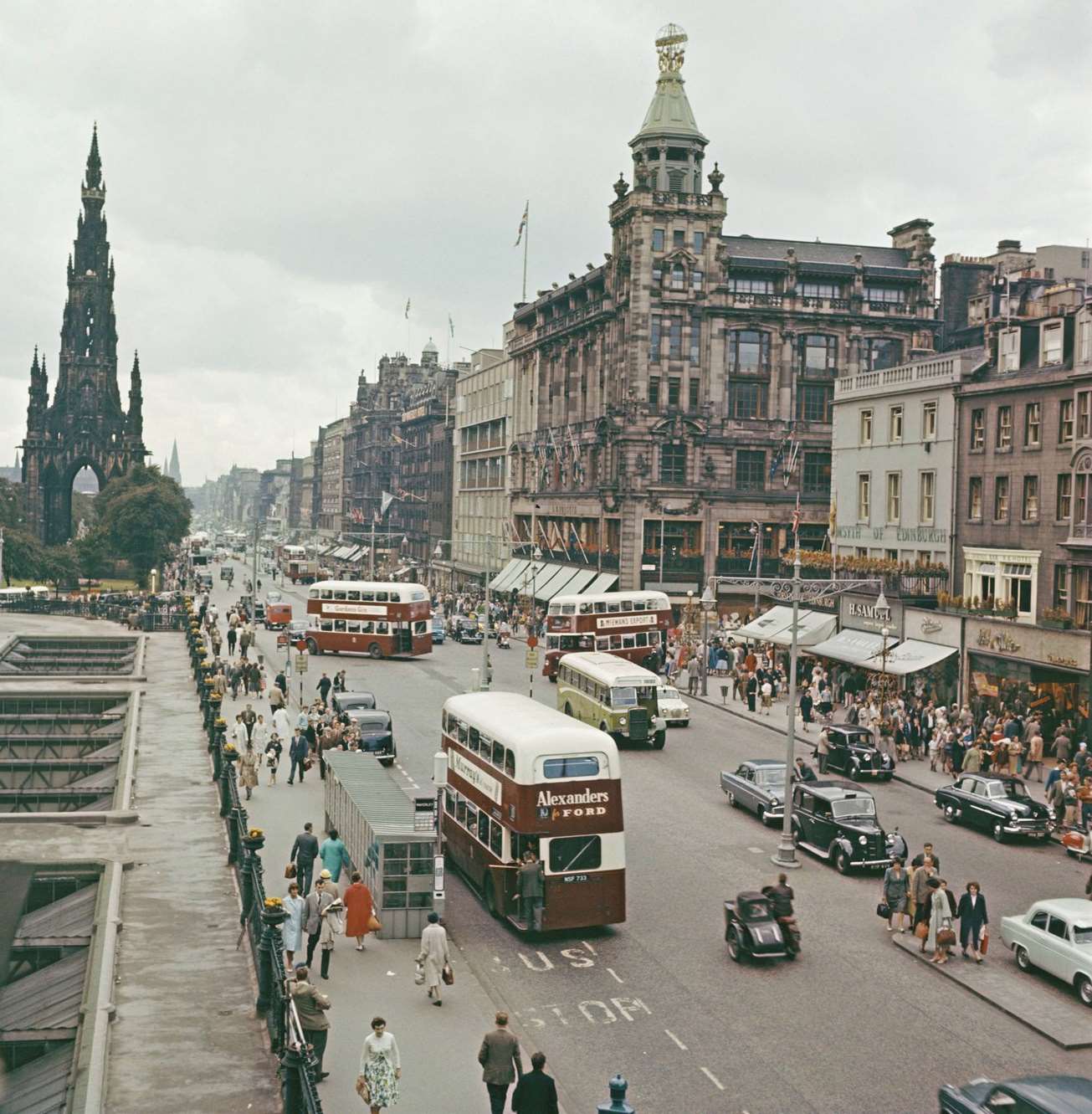 #2 Buses, cars and pedestrians making their way along Princes Street in Edinburgh, Scotland during the Edinburgh Festival in 1960.