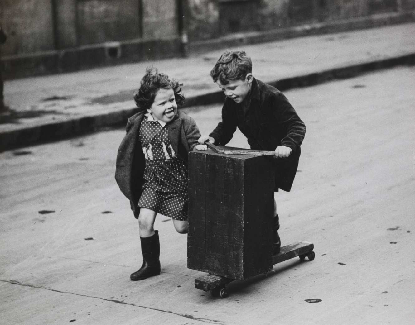 #10 Brother and Sister Make the Roadway a Playground Outside Their Home in Hospital Street, Gorbals, 1950