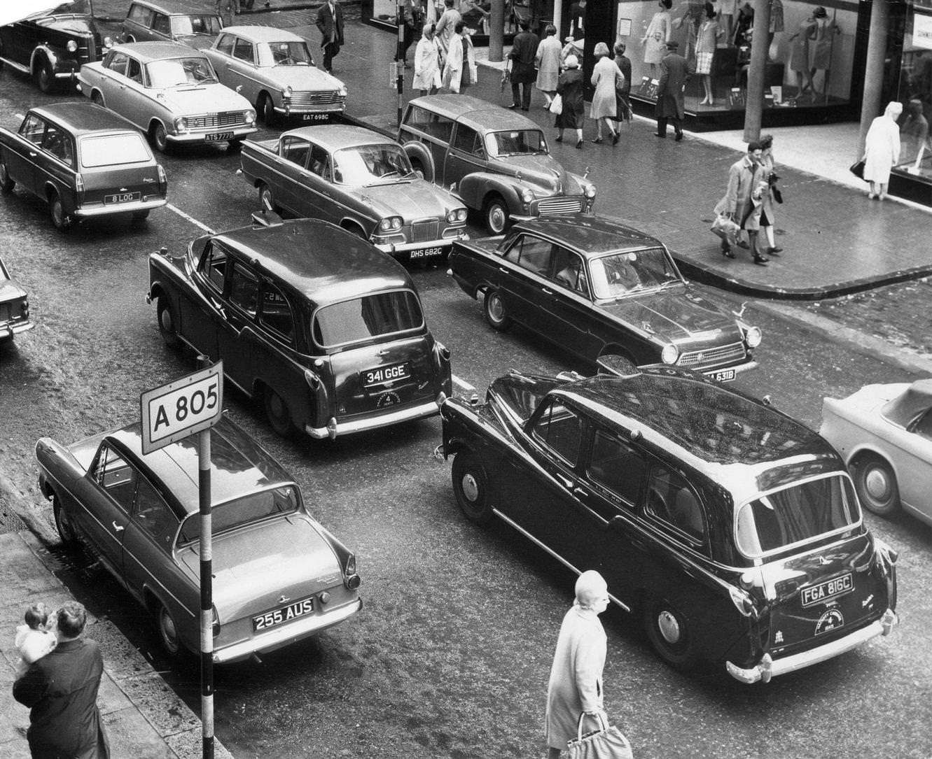#125 Taxis in a Glasgow street, stuck in traffic around the city centre, August 1965.
