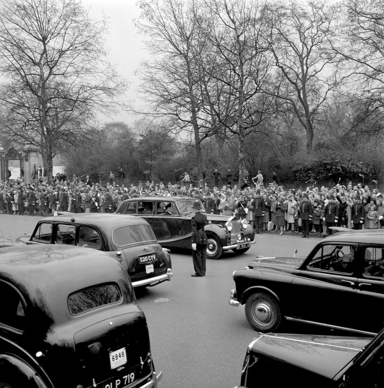 #141 Mall traffic is brought to a standstill as the car carrying Princess Alexandra of Kent and her husband Angus Ogilvy sweeps out from St James’s Palace, 1963