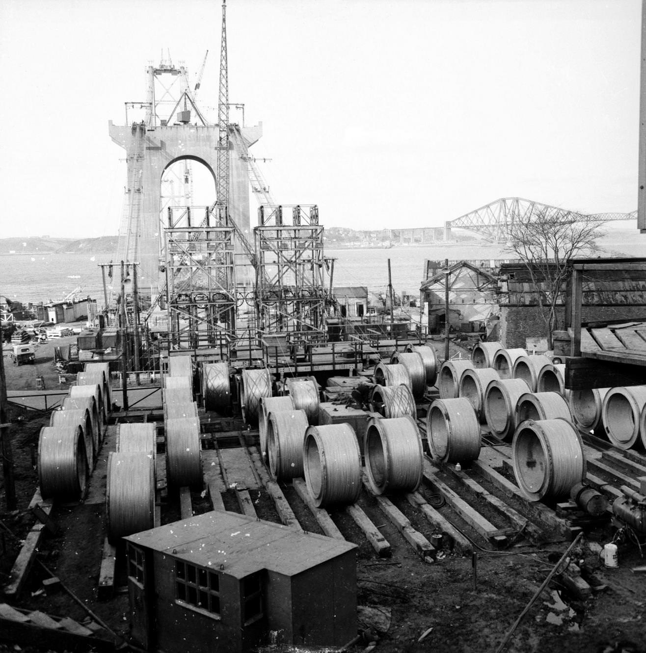 #150 Reels of quarter-inch wire are drawn from here to the cable anchorage at the other end of the Forth Road Bridge, 1962