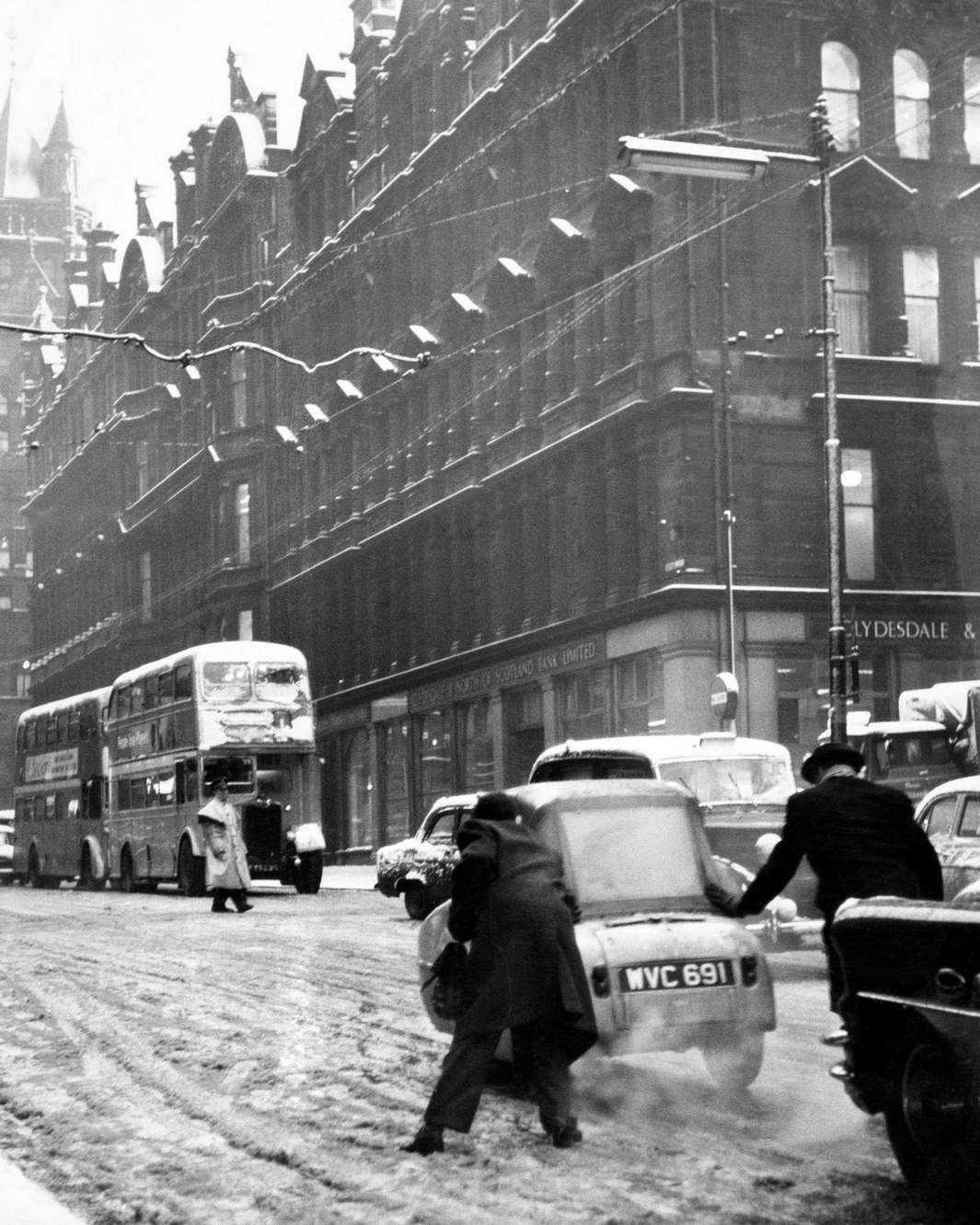 #58 Chaotic road conditions cause big traffic hold ups in the centre of Glasgow, 1961