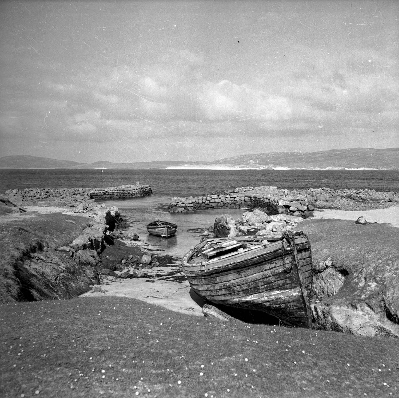 #74 Boats at Eoligarry Jetty on North Bay on the island of Barra in the Outer Hebrides, 1960