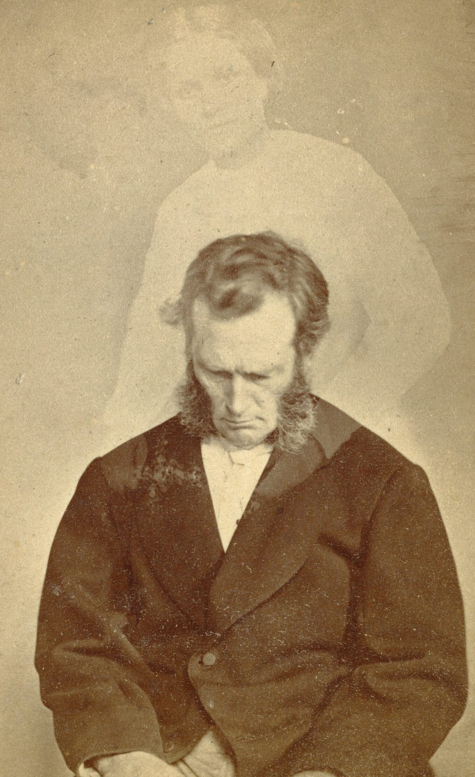 #10 Portrait of Bronson Murray with full sideburns looking down. A faint image of a woman is visible above him.