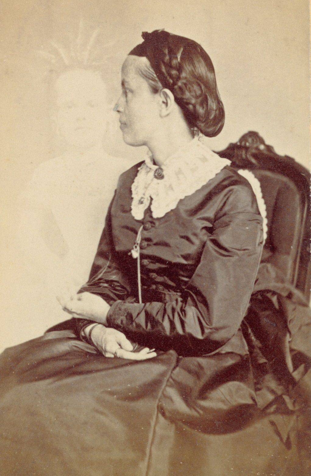 #13 Profile portrait of Ella Bonner, with a faint image of a child visible next to her.