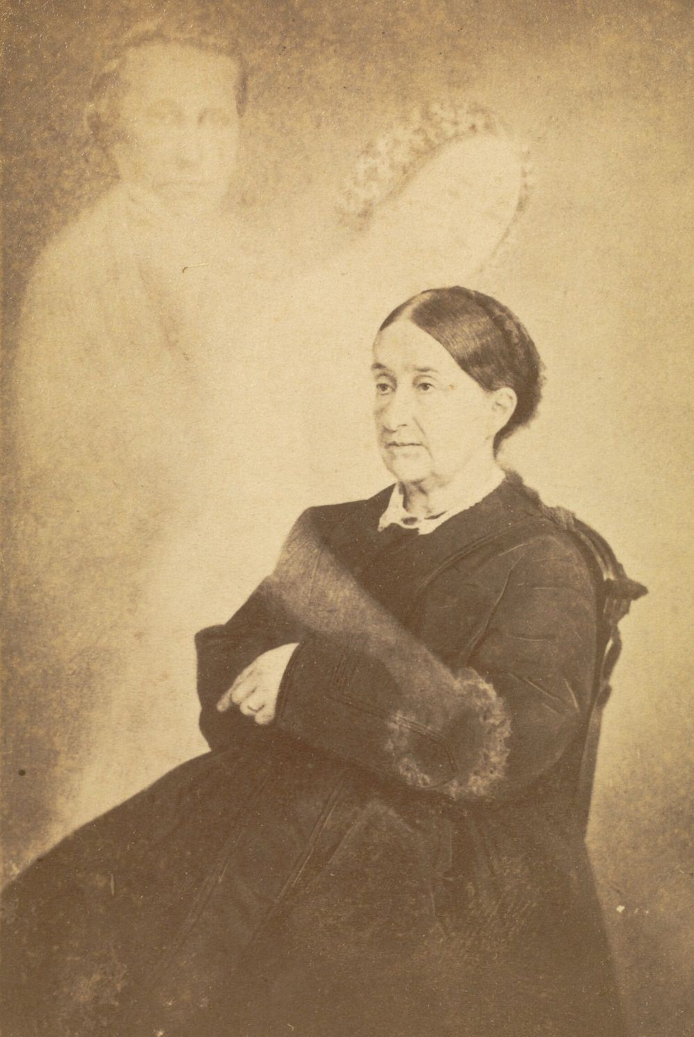 #32 Portrait of Mrs. Swan with her arms crossed. Faint images of a man and a woman reaching out her hand are next to Mrs. Swan.