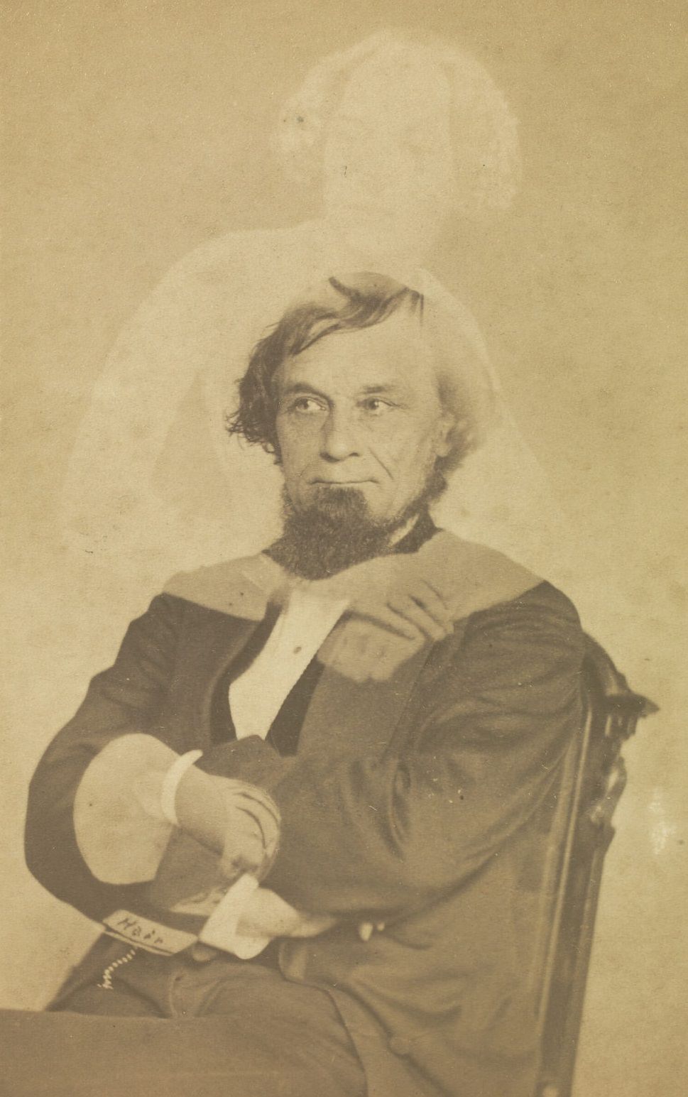 #4 Portrait of Col. Cushman with a goatee. There is a faint image of a woman with bobbed hair above him.