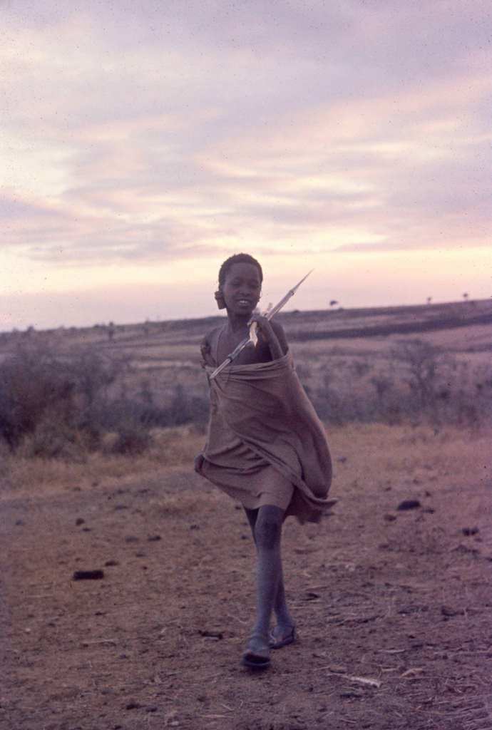 #30 A shepherd as he holds a spear, Tanzania, 1962.