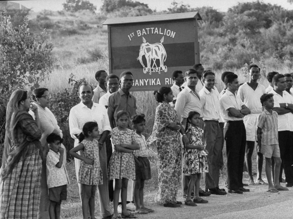 #22 Local residents stand outside Colito Barracks, where mutineers are imprisoned, in Dar es Salaam, 1960s