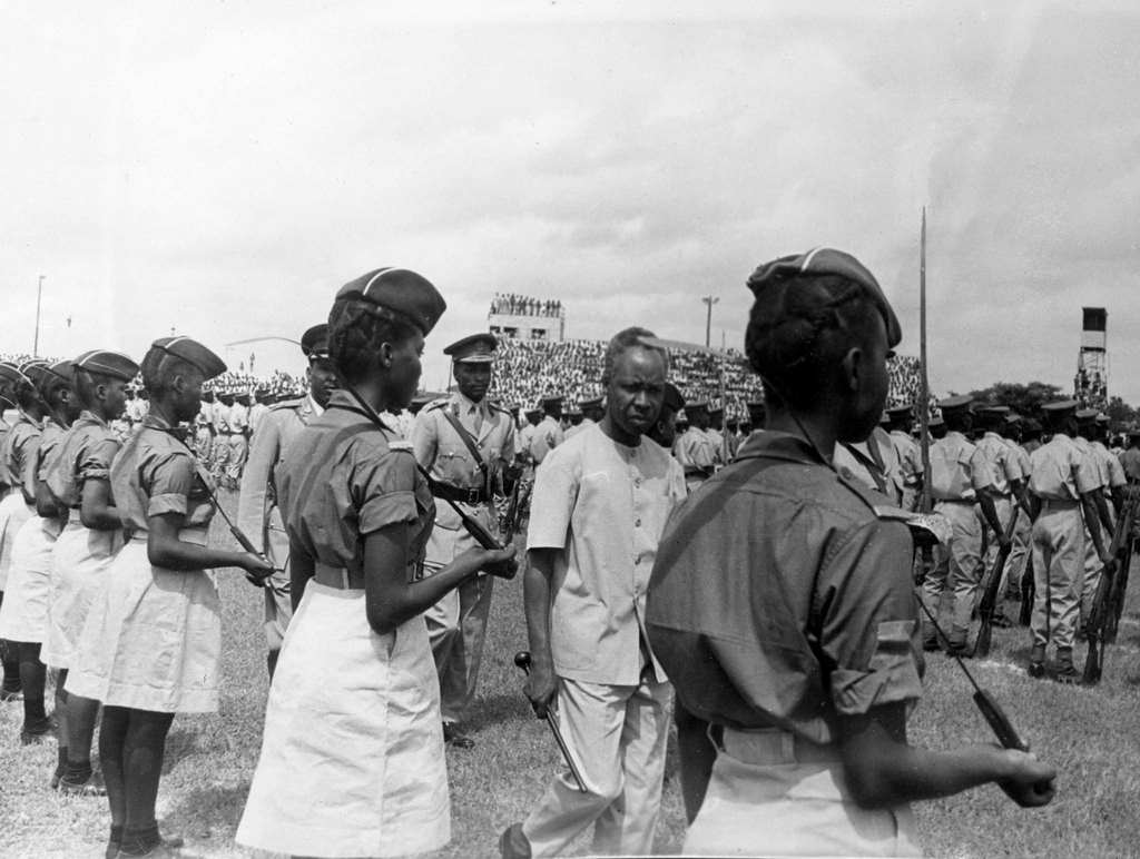 #4 Tanzanian President Julius Nyerere inspecting a contingent of young national service women who carry long knives over their shoulders, in Dar es Salaam, Tanzania on May 2, 1968.