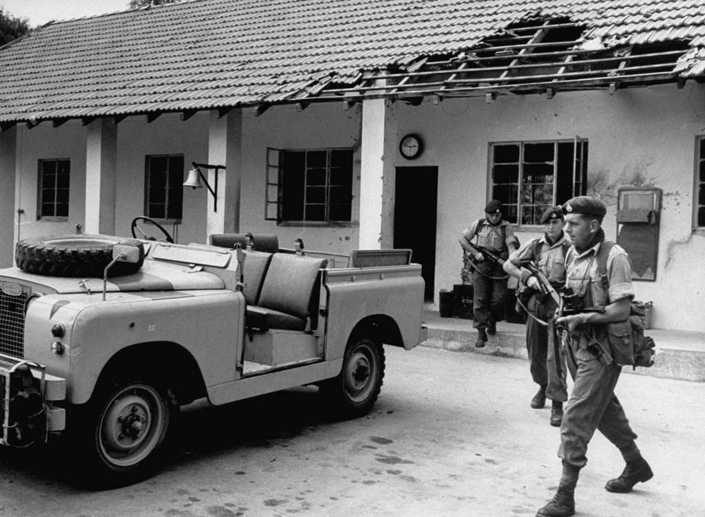 #23 Members of the British Royal Marines (possibly 45 Commando Royal Marines) clear out the armory at Colito Barracks in Dar es Salaam, 1960s