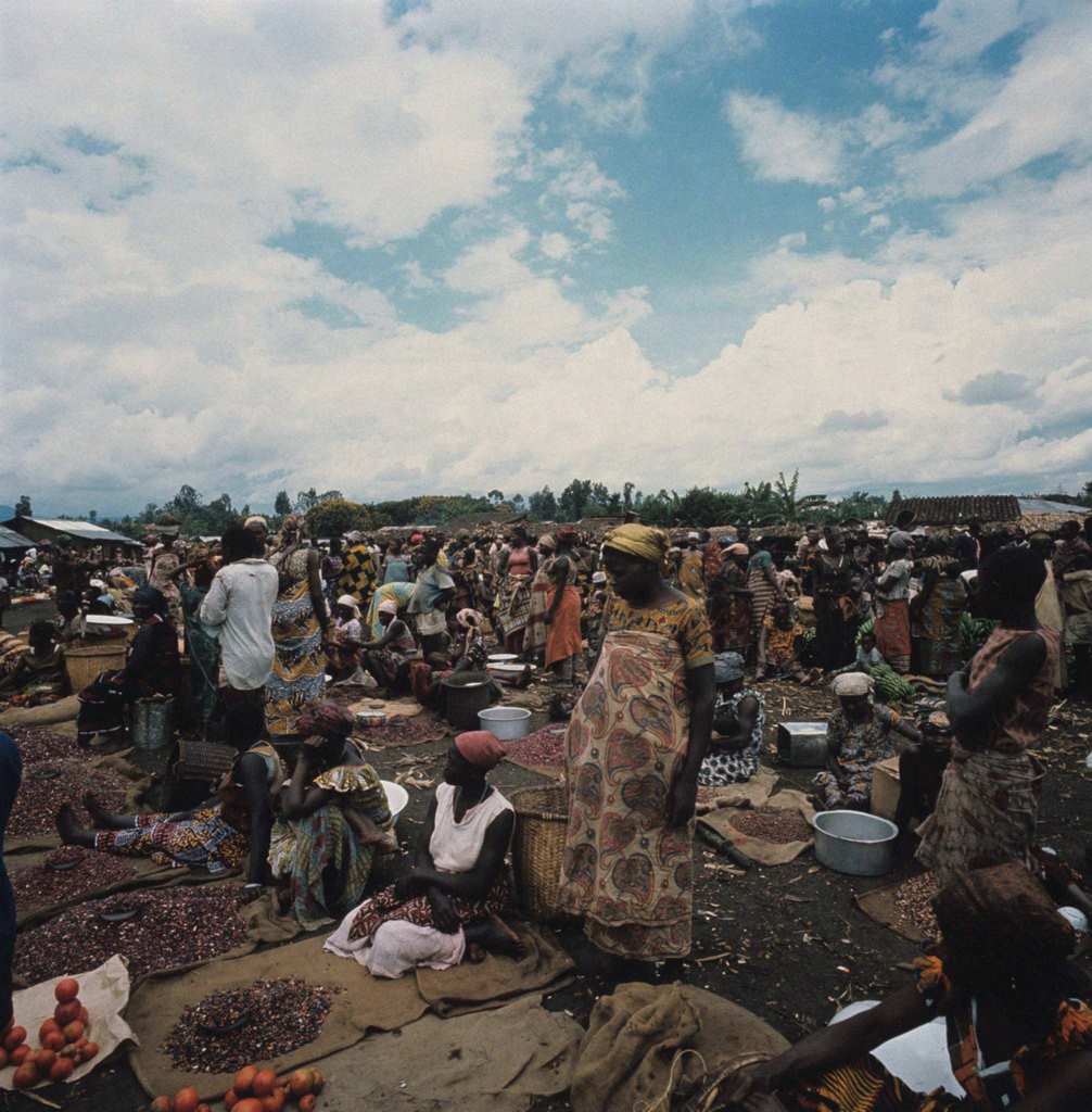 #46 Women waiting to sell their goods on display on mats at the market. Africa, 1960s