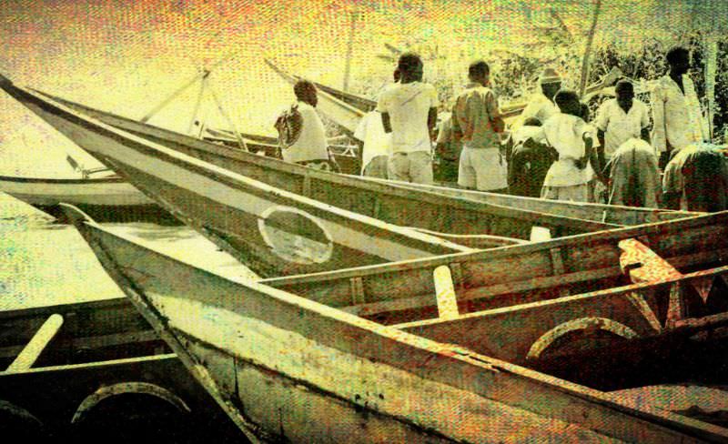 #57 A typical scene–boats have landed with fish for sale from the beach, 1969