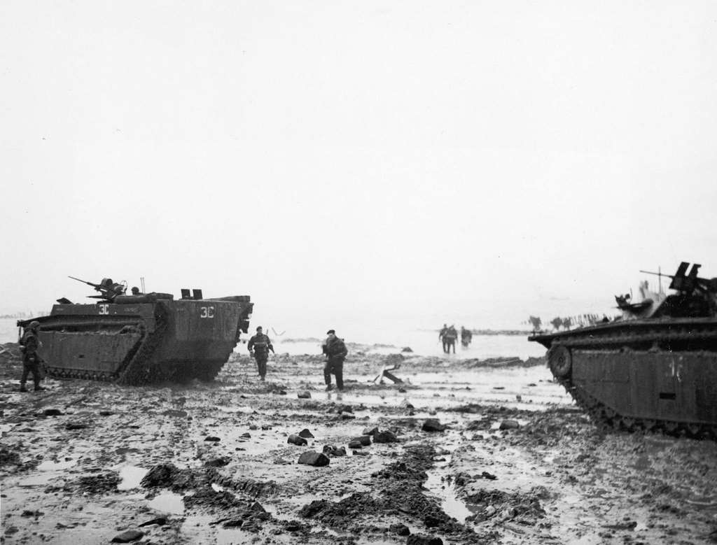 #26 Amphibious tanks on the beach, showing troops wading ashore in the background, 1950s