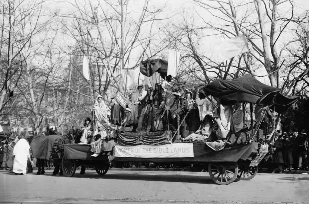 #2 Woman Suffrage Parade held in Washington, D.C., March 3, 1913 showing a float with banner ‘Women of the Bible Lands’ passing the U.S. Capitol.