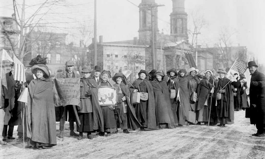 #24 American suffragists Rosalie Jones and Ida Carft lead a march, 1913.