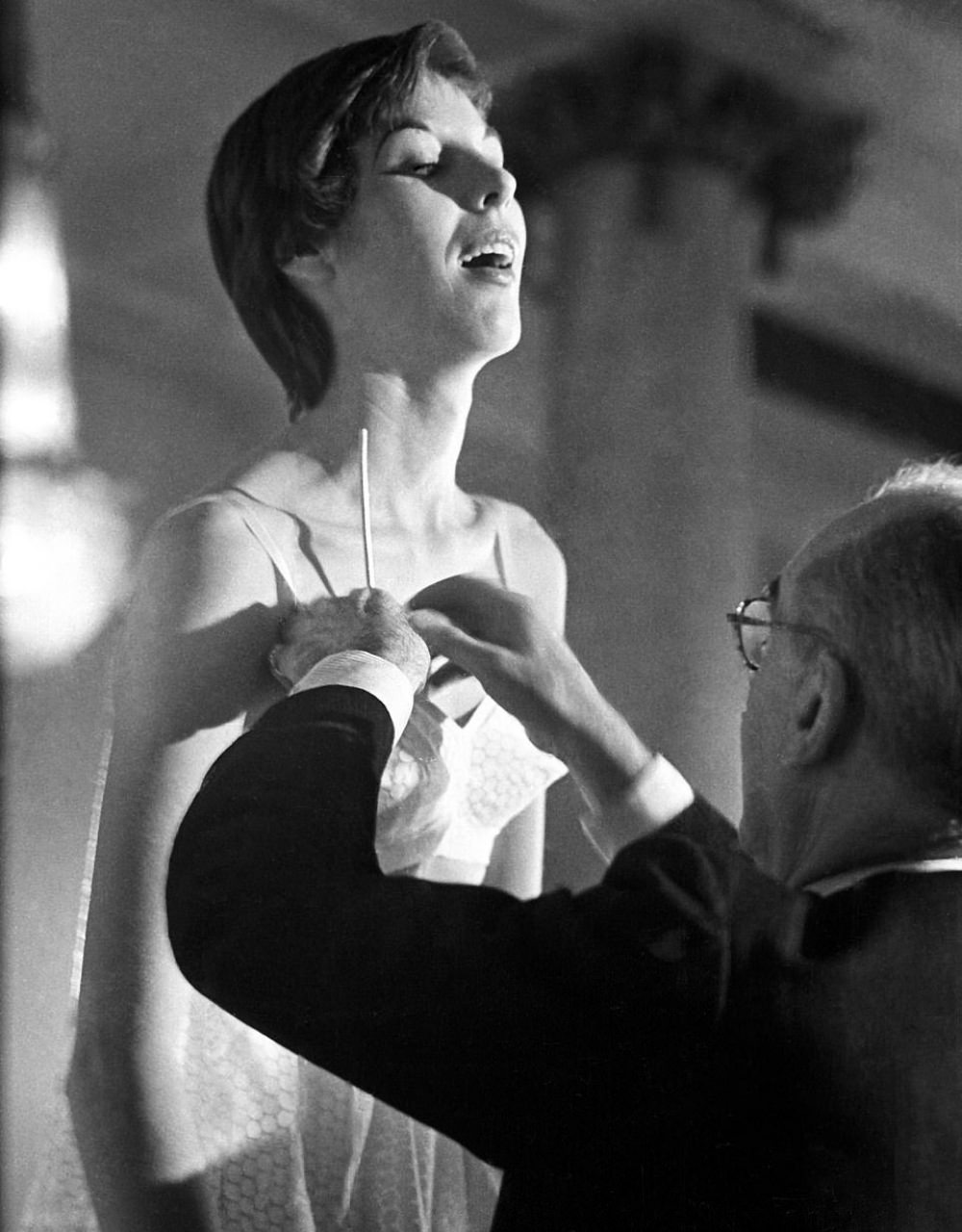 The salesman lets the crowd in on how the bra works, as he is seen inflating a model’s secret inflatable pads.