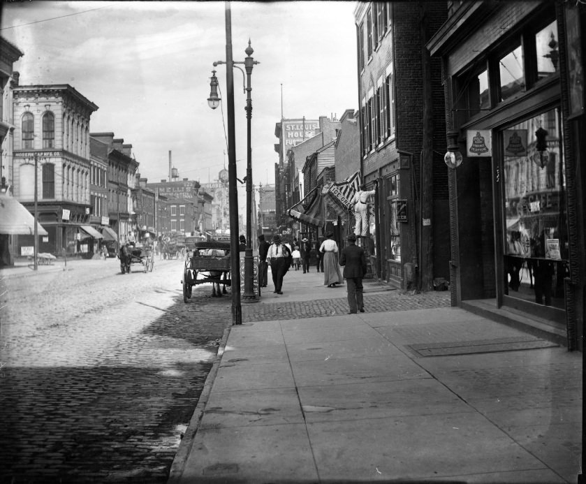 #139 North 7th Street showing people at work and walking along street, 1904