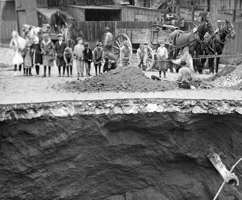 #158 Children standing along and hanging on a rope near a construction site, 1904