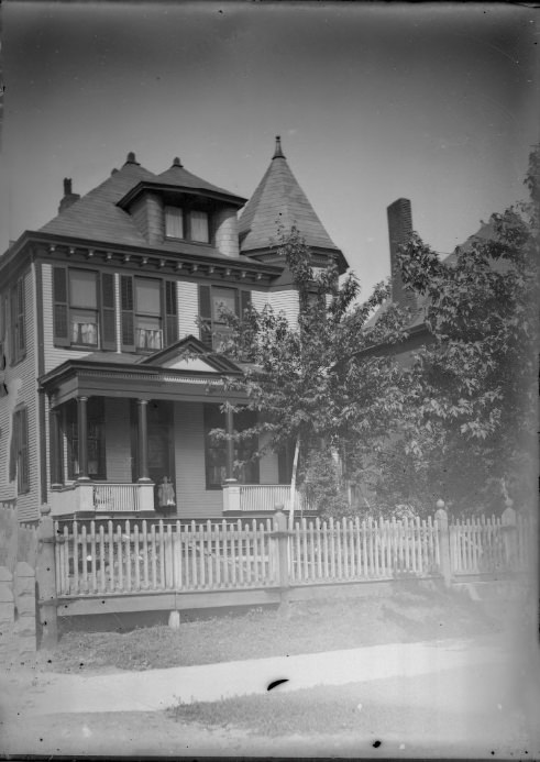 #224 A Child Standing on the Porch of a Large House, 1901