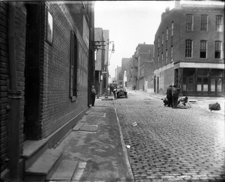 #104 Intersection of Second Street with another street with men working in the middle of the intersection, 1907