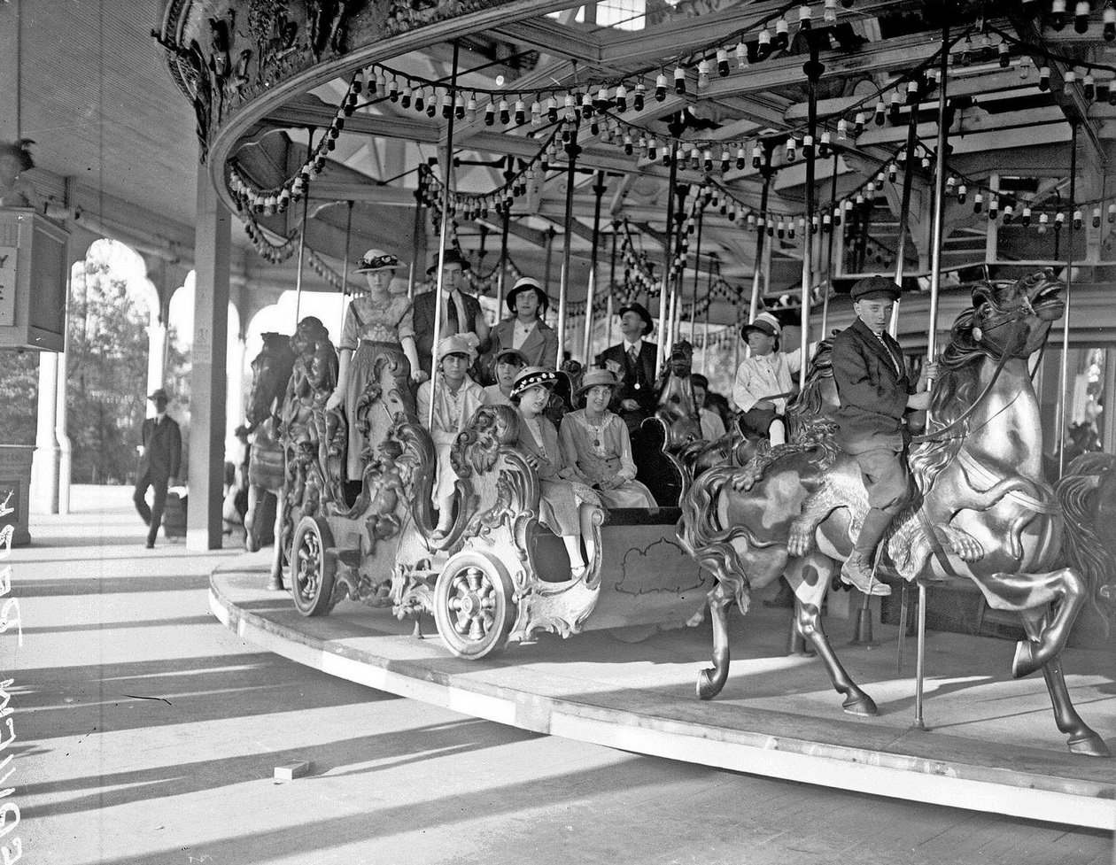 #99 Children and adults on merry-go-round at Riverview Park, Chicago, Illinois, 1915.