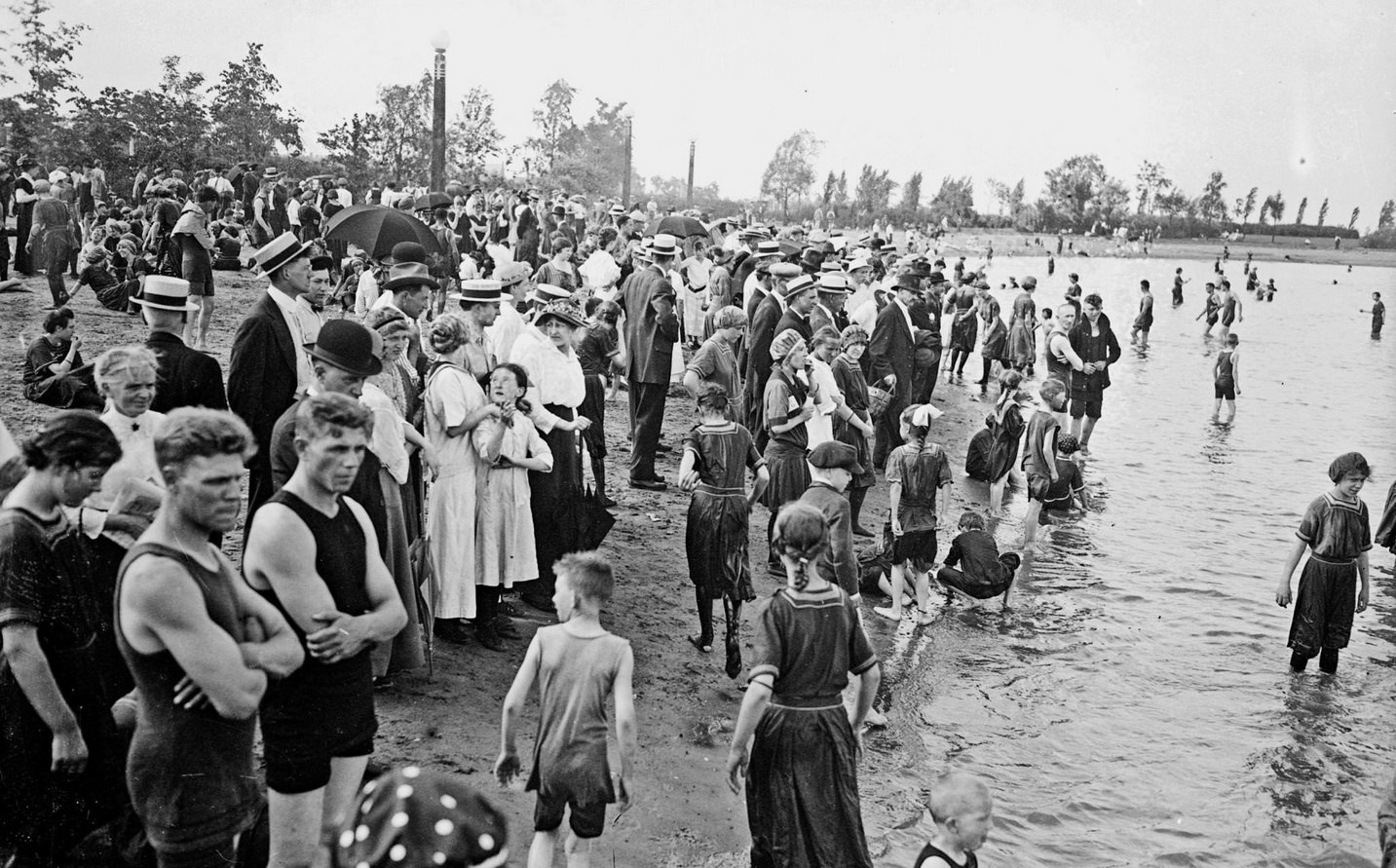 #110 Swimmers and spectators on the shoreline of Lake Michigan at Diversey Beach, in the Lincoln Park community, Chicago, Illinois, 1915.