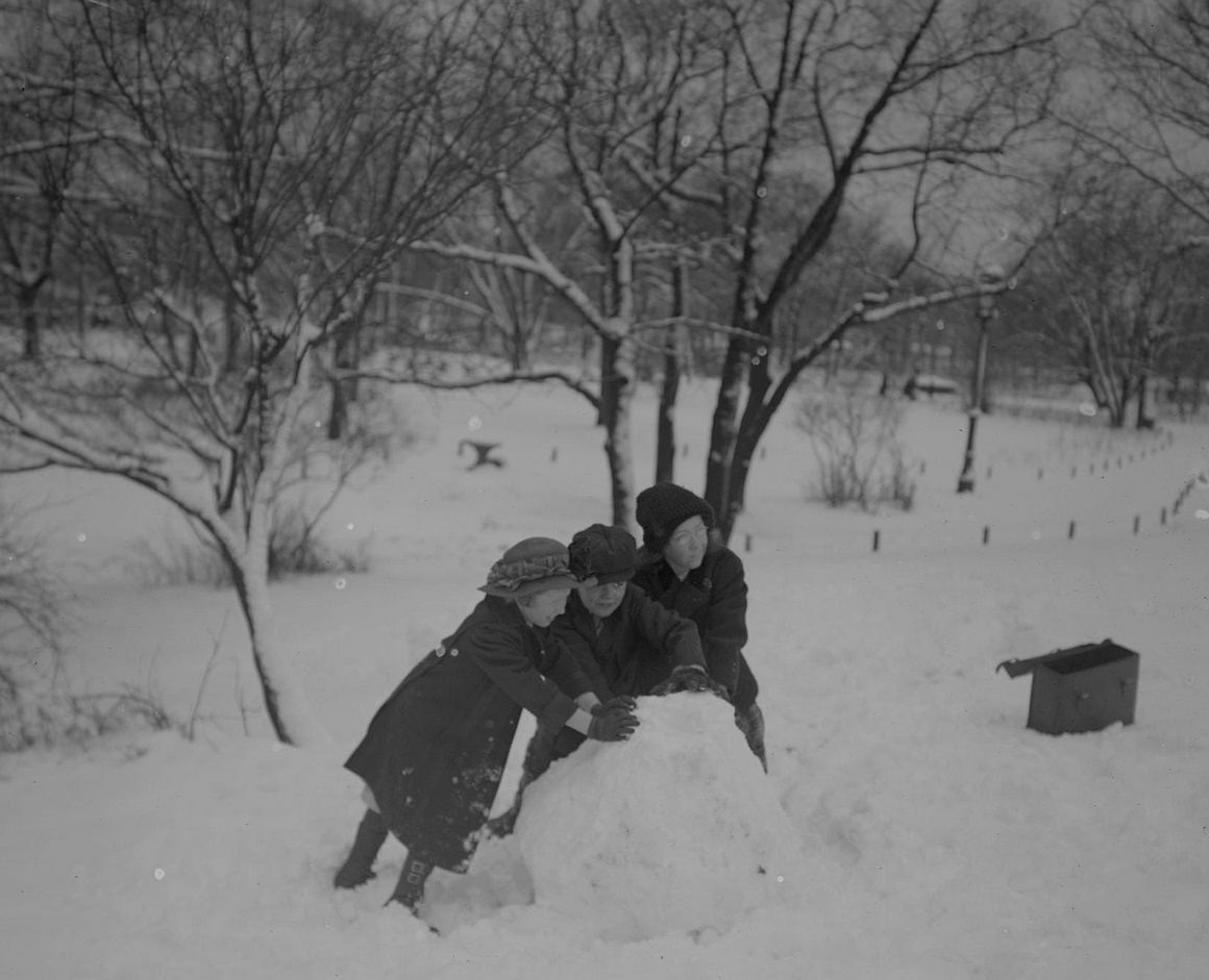 #134 Children rolling up a large ball of snow in Lincoln Park, Chicago, Illinois, 1910s.
