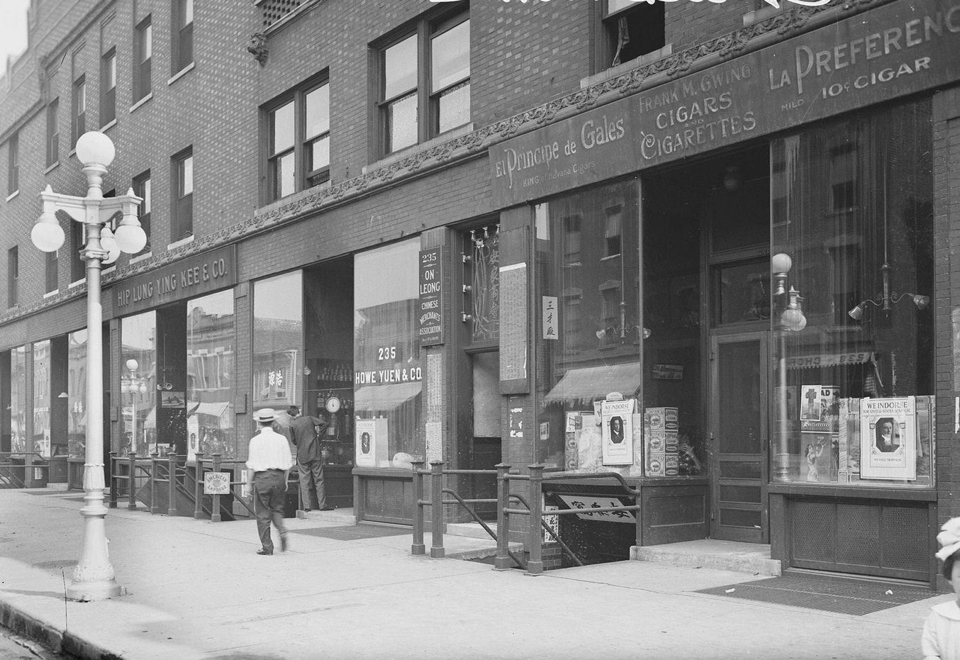 #138 View of storefront in Chinatown, Hip Lung Yung Kee & Company, at 233 West 22nd Street in the Armour Square community area of Chicago, Illinois, 1910s.