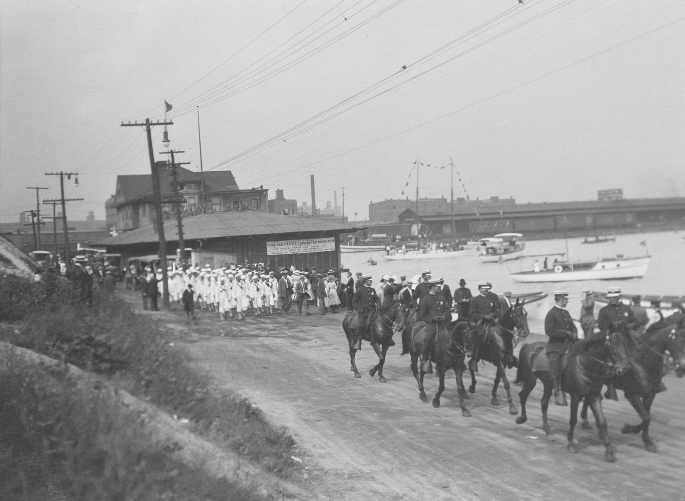 #156 Sailors from the USS Wolverine of the Navy following mounted Chicago policemen, Chicago, Illinois, 1910s.