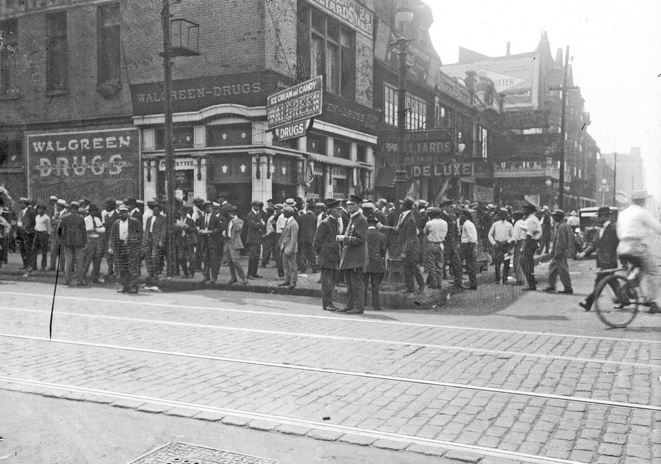 #49 Chicago race riot, African American men standing in front of Walgreen Drugs, 35th and State, Chicago, Illinois, July 30, 1919.